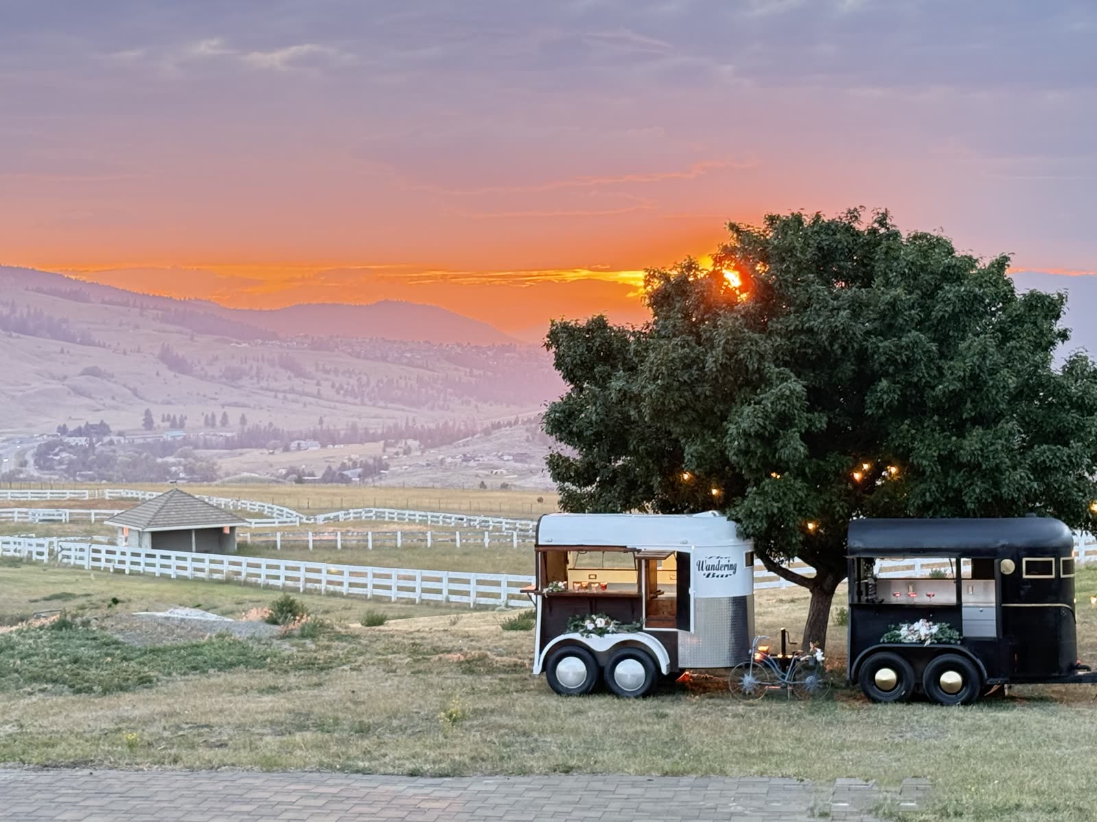 Wandering Bar trailers at sunset with mountain view